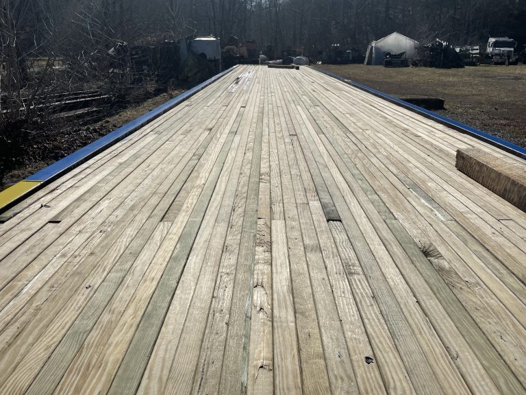 Portable timber bridge showcasing wooden planks and structural elements, emphasizing durability and engineering innovation, relevant to E&H Manufacturing's focus on sustainable infrastructure solutions.