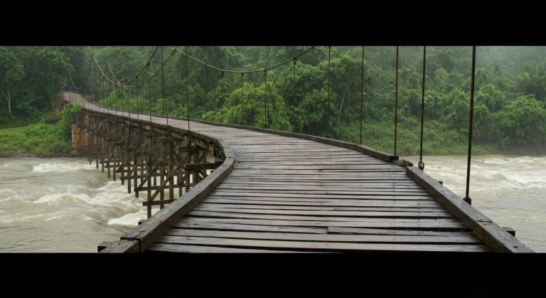 Stress-laminated timber bridge spanning a river, surrounded by lush greenery, illustrating temporary bridge solutions in a natural setting.